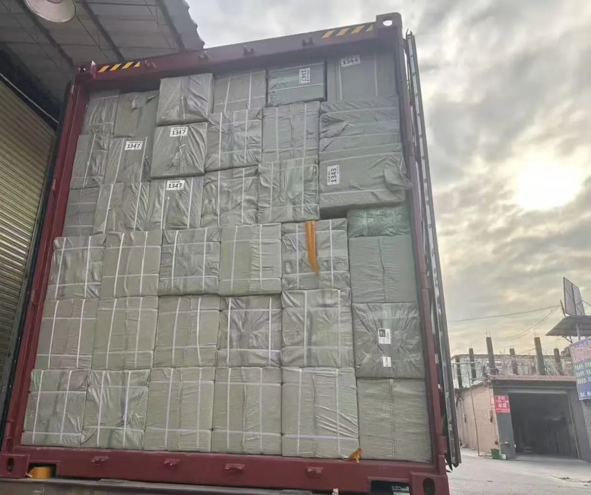 Finished custom backpacks packed in export cartons and loaded into a 40ft container at the Batelipack factory in Baoding, Hebei, China